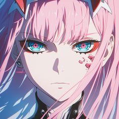 an anime character with pink hair and blue eyes looking at the camera while wearing horns