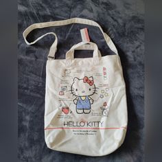 Sanrio Hello Kitty Canvas Tote/Crossbody Comes With Adjustable Strap Very Deep Has Small Spots But Not Noticable See Pics For Details 13x15x4" White Hello Kitty Print Bag, Hello Kitty Canvas, Hello Kitty Bags, Womens Tote Bags, Canvas Tote, Adjustable Straps, Hello Kitty, Kitty, Cream