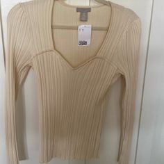 Really Cute Long Sleeve Cream Colored Top. Sweet Heart Neck. It’s Ribbed And Stretchy Material. Nwt From H & M, Size Medium. H&m Cotton V-neck Tops, H&m V-neck Cotton Tops, Fitted Cream V-neck Top, H&m Cream Long Sleeve Top, H&m Long Sleeve Cream Top, Fitted Beige H&m Tops, H&m Beige Tops For Spring, Fitted H&m Tops For Fall, Chic Beige H&m Top