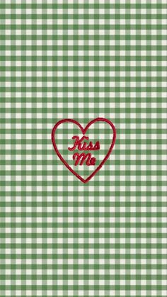 a green and white checkered background with a red heart that says miss you on it