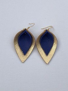 katie-double-layered-leather-leaf-shaped-earrings-in-navy-blue-and-metallic-gold Blue And Gold Earrings, Birthstone Jewelry Mothers, Cricut Earrings, Leather Leaf Earrings, Leather Earring, Leather Leaf