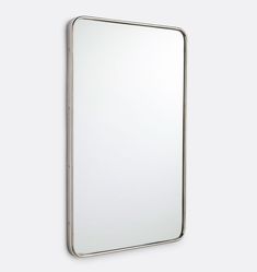 an empty mirror hanging on the wall