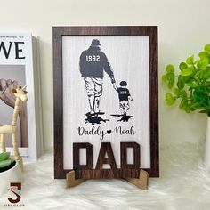 a father's day gift is displayed on a shelf