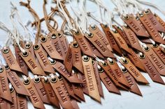 many wooden tags are hanging on strings