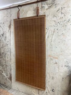 a brown window covering hanging on a wall