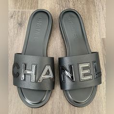 Chanel 2023 Black Leather Slides Size 37 It= 6.5 Us New In Box With Dust Bag Sold Out Everywhere Black Flat Heel Calf Leather Sandals, Luxury Black Flat Heel Sandals, Black Leather Flat Shoes, Black Leather Slides, Black Flat Leather Shoes, Chanel Slides, Chanel 2023, Shoes Slides, Shoes Outfit Fashion