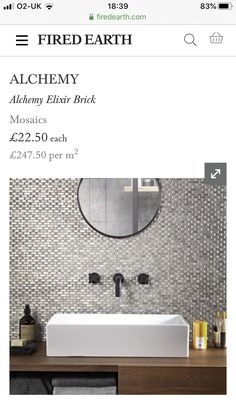 a white sink sitting under a mirror in a bathroom