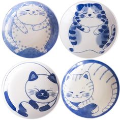 three blue and white plates with cats on them