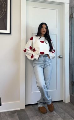 Ligh wash wide leg high rise jeans, ugg tasman slippers, white knit sweater with red hearts. #petitefashion #casualoutfit #outfitinspo #outfitideas #whattowear #casualwear #uggs #fashion #style #ootd #stylingtipa #outfitpost White Tee And Blue Jeans Outfit, Casual Valentines Outfit, Oversized Jeans Outfit, Outfit For Valentines Day, High Rise Jeans Outfit, Uggs Fashion, Valentines Day Outfits, Slippers White, Tasman Slippers