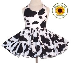 This fun little sundress is so adorable for your little cowgirl. Made with a cow print halter top attached to a very full hand ruffled two tier cow print twirly square dance skirt. 100% cotton dress has ribbon ties at neck and elastic at back waist to make it adjustable and child can wear longer. Skirt is made extra full for little cowgirl’s twirling fun. Made in the USA.Dress is shown with one of my double layer petticoats under for added fullness, not necessary, but lots of fun! Sizes: 3-6M, 6 Fitted Twirl Dress For Beach In Spring, White Twirl Dress For Summer Fun, Cute Fitted Twirl Dress For Beach, Fitted Twirl Dress For Beach, Playful Fitted White Sundress, Sleeveless Fitted Twirl Dress For Beach, I Love Lucy Costume, Cow Print Fabric, Usa Dress