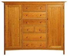 a large wooden cabinet with drawers and doors