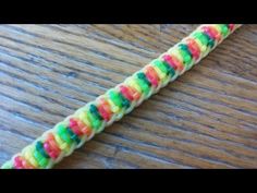 a rainbow loom bracelet on a wooden table