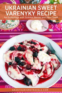 a white plate topped with berries and cream