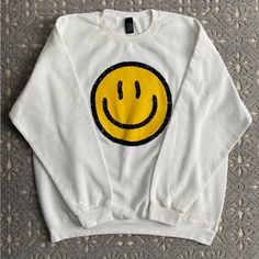 Women’s White Smiley Face Sweatshirt With Classic Yellow Smiley Face. Size Large (Fits Like Roomy Large/Xlarge), Brand New Never Worn. It Shipped When I Bought It Without Any Tags But It Is New Not Worn Or Washed. Brand Is Sweet Claire. From A Smoke And Pet Free Home. Smiley Face Sweater, Smiley Face Hoodie, Xlarge Brand, Smiley Face Sweatshirt, Yellow Smiley Face, Face Pictures, Face Cloth, Clothing Ideas, Smile Face