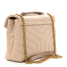 This is an authentic SAINT LAURENT Calfskin Y Quilted Monogram Small Loulou Chain Satchel in Dark Beige. This elegant shoulder bag is crafted of chevron calfskin leather in beige. The bag features an aged gold chain link shoulder strap with a matching leather shoulder pad. The frontal flap features a prominent gold YSL monogram detail and opens to a partitioned black fabric interior with a patch pocket and a zipper compartment. Quilted Toys, Vanity Bag, Baby Monogram, Chevron Quilt, Gold Monogram, Dark Beige, Saint Laurent Bag, Wallet Chain, Black Cross Body Bag