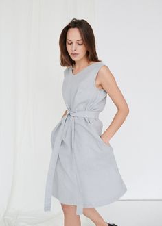 "SIZING & FIT This garment is true to size, and we recommend choosing the size you usually wear. If you want the garment to be loose-fitting, choose a larger size than you usually wear. Before placing an order, check the approximate measurements of the finished garment given below. Model is 5′6″ (170cm) tall with a 80cm/31″ bust, 68cm/26″ waist, 91cm/35″ hip, and she is wearing an XS in ice grey. XXS Length ± 105cm | 41.3\" Bust ± 92cm | 36.2\" Armhole ± 44cm | 17.3\" Hem width ± 134cm | 52. V-neck Sleeveless Linen Dress For Daywear, Gray Knee-length Midi Dress For Summer, Gray Knee-length Summer Midi Dress, Linen Sundress For Spring, Spring Linen A-line Dresses, Spring A-line Linen Dresses, Gray Cotton Summer Dress, Summer Gray Cotton Dress, Elegant Flax Color Dress For Spring