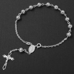 Description: Sterling Silver 925 Filigree Rosary Bracelet 6 Mm Metal Type: Guaranteed .925 Sterling Silver With Stamped 925 Finish: High Polished Measurement: 8 Inches. Bead: 6.3 Mm Brand New With Box #B14-6 Nickel-free Sterling Silver Rosary Bracelet, Classic Silver Rosary Bracelet As Gift, Engraved Silver Rosary Bracelet As Gift, Elegant Silver Rosary Bracelet With Polished Beads, Elegant Sterling Silver Rosary Bracelet With Round Beads, Elegant Silver Rosary Bracelet With Silver Beads, Elegant Silver Charm Bracelet With 8mm Beads, Sterling Silver Rosary Bracelet With Silver Beads, Elegant Silver Rosary Bracelet With 8mm Beads