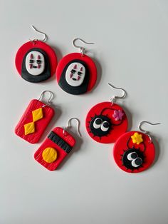 Handmade Polymer Clay Earrings inspired by the animated movie, Spirited Away.  Choice of 3 designs: Bath Tokens, No Face, or Soot Sprites. Measurements:      - Drop length: 2 - 2.5in       - Width: 1 - 1.5in      - Weight: ~0.5oz *IMPORTANT!!      - Each earring is handmade, therefore no two will look exactly the same and there may be some minor imperfections on the earrings. Themed Red Earrings, Ghibli Clay Earrings, Anime Earrings Clay, Studio Ghibli Beaded Earrings, Totoro Clay Earrings, Ghibli Earrings, Soot Sprite Clay Earrings, Anime Earrings, Soot Sprites