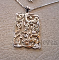 "Love pendant with famous poem verse sterling silver 925 jewelry Arabic \" Your eyes alone are my legitimacy \"عيناك وحدهما هما شرعيتي قصيدة مشهورة للشاعر الكبير نزار قباني عيناك وحدهما هما شَرعيَّتي مراكبي، وصديقتا أسفـاري إن كان لي وطنٌ، فوجهُك موطني أو كان لي دارٌ ، فحبك داري من ذا يحاسبني عليك وأنت لي هبةُ السماء ونعمةُ الأقدارِ؟ من ذا يُقاضيني وأنت قضيتي ورفيقُ أحلامي، وضوءُ نهاري من ذا يهددني وأنت حضارتي وثقافتي، وكتابتي، ومناري Arabic poem verse says : Your eyes alone are my legitimacy My Symbolic Silver Jewelry With Name, Symbolic Silver Jewelry With Name Detail, Meaningful Silver 925 Stamped Jewelry, Meaningful Silver Jewelry Stamped 925, Personalized Symbolic Silver Jewelry, Spiritual Sterling Silver Jewelry With Engraved Text, Silver Necklace With Name On Rectangular Pendant, Silver Rectangular Pendant Jewelry With Name, Silver Jewelry With Engraved Text As Gift