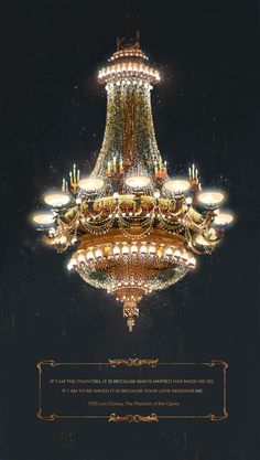 a chandelier hanging from the ceiling in front of a black background with gold trim