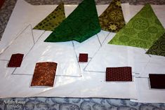 the quilts are laid out and ready to be sewn together for christmas trees