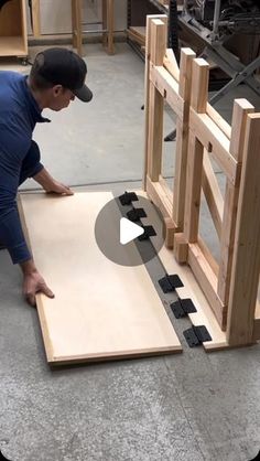 a man is working on some wood