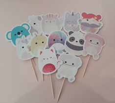 a bunch of cute little animal cupcake toppers