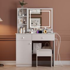 a white vanity with a mirror and lights on the top shelf next to a lamp