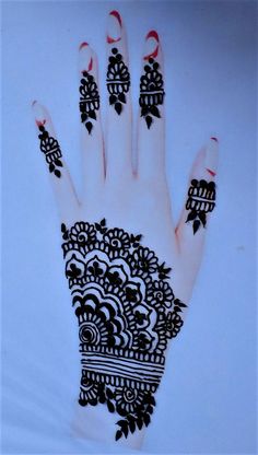 a hand with black and white designs on it