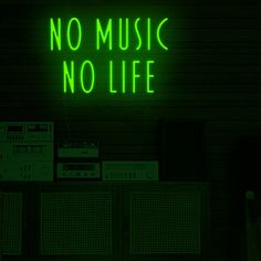 a neon sign that says no music no life in front of some old stereos