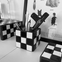 black and white checkered desk accessories on display