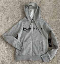 BEBE SPORT GRAY LOGO HOODED SWEATSHIRT  SIZE SMALL NEW WITH TAGS Winter Athleisure Sweatshirt With Logo, Athleisure Hoodie Sweatshirt With Logo Detail, Gray Sporty Hoodie Top, Sporty Gray Hoodie Top, Gray Sports Hoodie With Letter Print, Sporty Sweatshirt With Logo For Loungewear, Fall Fleece Hoodie With Logo Detail, Sporty Logo Sweatshirt For Loungewear, Athleisure Crew Neck Hoodie With Logo