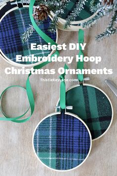 three christmas ornaments hanging from the side of a wooden table with text overlay reading easy diy embroidery hoop christmas ornaments