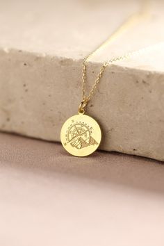 Gold Compass Pendant - Mountain Gold Necklace ● Material of pendant: Solid Gold 14k ( REAL GOLD ) ● Metal Stamp: 14k ( REAL GOLD ) ● The pendant is available in 5 sizes: - 12,7 mm / 0.5 inches (Diameter) - 14,0 mm / 0,55 inches ( Diameter ) In the photos - 15,3 mm / 0.6 inches ( Diameter ) - 16,5 mm / 0,65 inches ( Diameter ) - 19,1 mm / 0,75 inches ( Diameter ) ( In the photos the size is 14mm / 0.55 inches Diameter ) ( Jump Ring inner diameter: 4 mm ) ● Material of chain: Solid gold 14k ( REAL Personalized Gold Jewelry For Travel, Gold Medallion Necklace As Souvenir, Gold Engraved Jewelry For Travel, Gold Medallion Necklace For Souvenir, Engraved Medallion Necklace For Travel, Personalized Gold Necklace For Travel, Travel Engraved Gold Jewelry, Gold Medallion Jewelry For Travel, Personalized Pendant Necklaces For Travel