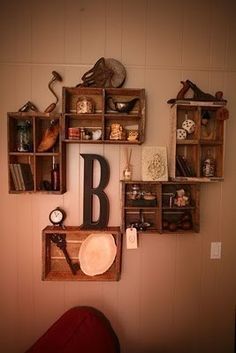 there is a wall with many different items on it and the letters b are in wooden crates