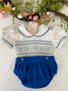 Pre-order handmade smocked romper. Thank you for your patience and for supporting a small business. Clothing Care Instructions Most items can be washed safely in cold water on delicate cycle and hung to dry. If the item that you are ordering has red or another bright color in it next to a white or other light color fabric please use a Shout color catcher for the first few washes to avoid bleeding. The reds are pre-washed but they are still red and will likely have some color transfer without a c Spring Bubble Romper With Smock Detail, Spring Fitted Smocked Bubble Romper, Spring Fitted Smock Bubble Romper, Cotton Fitted Bubble Romper With Smocked Back, Fitted Smock Bubble Romper For Summer, Cute Fitted Smocked Dress With Smocked Cuffs, Small Business Clothing, Smocked Romper, Business Clothing