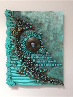 a piece of art that looks like it is made out of beads and other things