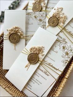 wedding stationery with flowers and monogrammed ribbon