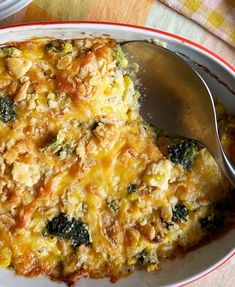 a casserole dish with broccoli and cheese in it on a plate