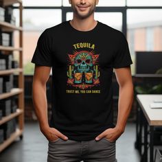 Get ready to dance the night away with our unique Tequila Skull T-Shirt! Perfect for any party, this shirt features a humorous "Trust Me, You Can Dance" slogan paired with a beautifully designed Mexican sugar skull surrounded by vibrant cacti and flowers. The playful design captures the festive spirit of a fiesta and is sure to be a conversation starter at any event. Made from comfortable, high-quality material, it's not just a fun addition to your wardrobe but also a cozy one. Available in vari Tequila Squad Shirts, Drinking Outfit, Day Drinking Outfit, Tequila Humor, Skull Top, Mexican Sugar Skull, Day Drinking, Fiesta Party, Gildan Sweatshirts