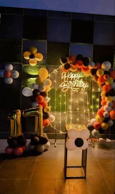 a birthday decoration with balloons and streamers