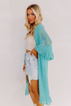 Relax in the summer evening breeze with this cute turquoise cardigan featuring lightweight knit material, oversized half sleeves, ruffle trim detailing, and a draped open front silhouette that falls into a straight mid-calf length hemline! Measurements S : Bust 46", Hip 44", Length 38", Sleeve Length 19", Waist 44". M : Bust 48", Hip 46", Length 39", Sleeve Length 19", Waist 46". L : Bust 50", Hip 46", Length 39", Sleeve Length 19.5", Waist 46".