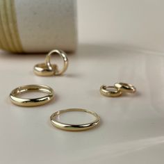 A minimalist and totally chic 2.6mm ring to add to your stack. Handmade from 14k gold, this ring features a modern dome design, and is perfect for stacking with other rings or for a minimal look on its own. Features: - Gold KT: 14K Gold - Custom Gold Color: Yellow Gold - Top Band Width: 2.6 mm Processing time & shipping: - Ready to ship in 1-2 Business Days - FREE shipping on all U.S. orders. - Once your parcel has shipped, we will update your order with a tracking number. Packaging: - Beautiful Gold Dome Ring, Ring Everyday, Logo Jewelry, Top Band, Solid Gold Ring, Dome Ring, Gold Top, Ring Minimalist, Modern Ring