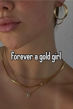 a woman wearing gold necklaces with the words forever a gold girl