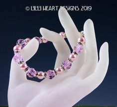 I AM SO EXCITED TO PRESENT MY NEW COLLECTION OF JEWELRY ALL MADE WITH SWAROVSKI CRYSTAL. I AM HAVING SO MUCH FUN MAKING THEM. THIS BRACELET WAS CREATED WITH SWAROVSKI PINK PEARLS MIXED WITH VINTAGE RETIRED LARGE ROSALINE PINK 10mm BEADS, SO SPARKLY WITH BEAUTIFUL LUSTROUS ROSALINE PINK SWAROVSKI PEARLS. I put a Silver Plated magnetic closure on for ease of putting it on and taking it off. I added a Sterling Silver safety chain with a Lobster clasp so you don't have to worry about loosing it. Thi Crystal Suncatchers Swarovski, Rhinestone Bridal Jewelry, Diy Friendship Bracelet, Pink Pearls, Heart Designs, Pink Swarovski, Swarovski Crystal Bracelet, Rhinestone Bridal, Safety Chain