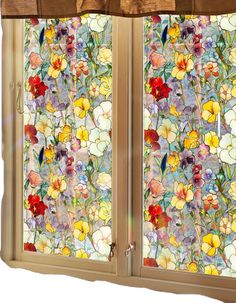 two stained glass windows with flowers on them