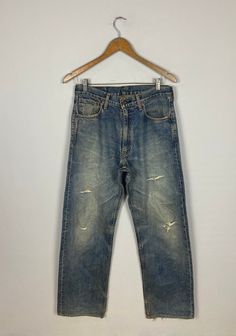 *ITEM: Vintage Levis 503 Japan Denim Faded               Blue Jeans 1990s Levis Jeans                               Distressed Levis Ripped Denim W31" *ITEM DETAILS: 👇🏻 Please be aware that all vintage items will usually show a few signs of wear or fading due to age, but anything visible such as stains or holes, and serious flaws have been photographed.For any further information on this item please contact us and we will be happy to help. *SIZE: 31" *ACTUAL SIZE MEASUREMENT: 👇🏻 *PIT TO PIT( Distressed Washed Blue 90s Bottoms, 90s Distressed Washed Blue Bottoms, 90s Washed Denim Blue Jeans, Retro Relaxed Fit Distressed Jeans, 90s Style Washed Denim Blue Jeans, Vintage Straight Leg Stonewashed Jeans, 90s Style Ripped Blue Jeans, Vintage Relaxed Fit Stonewashed Jeans, 90s Style Distressed Cotton Jeans