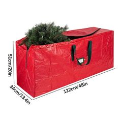 a large red bag with a christmas tree in it