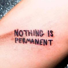 a tattoo saying nothing is permanentment on the arm