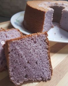 two slices of cake sitting on top of a white plate next to another piece of cake